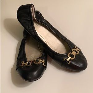 Tahari black flats with gold embellishment on toes